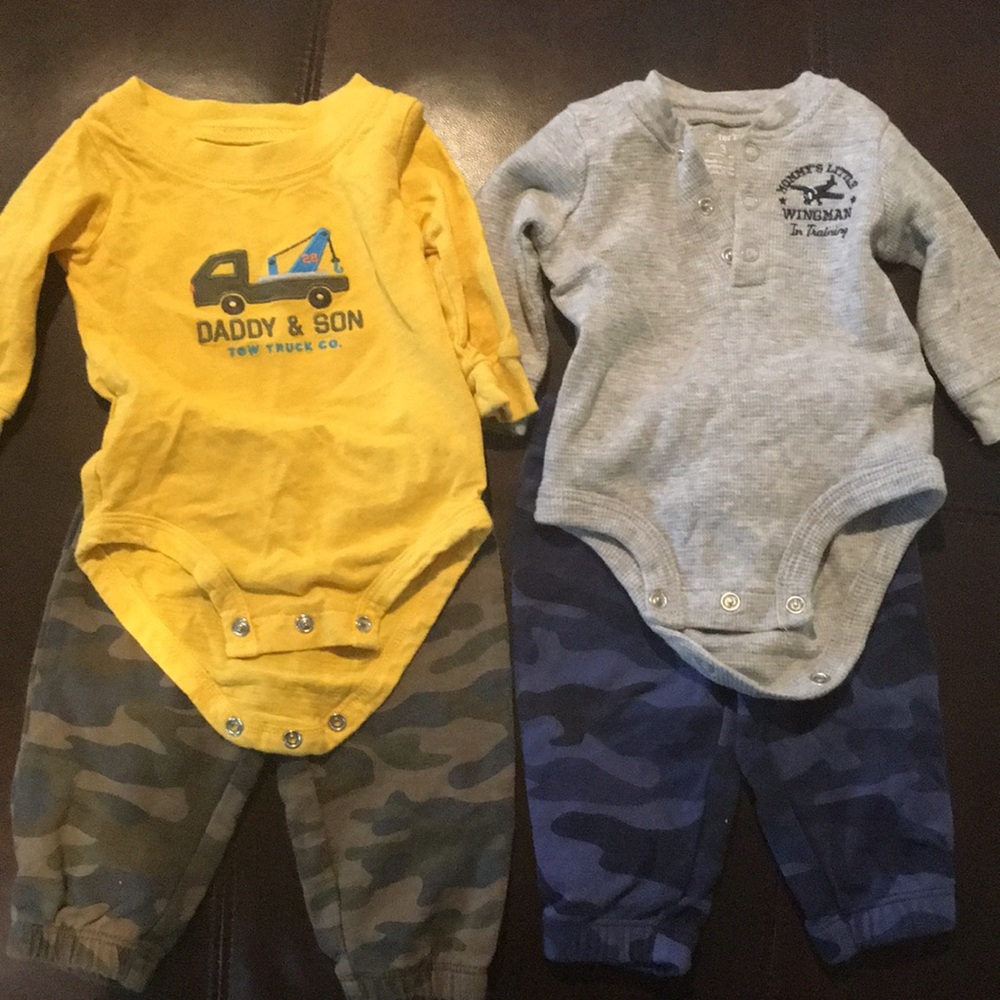 Two outfits camoflage pants and onesie.